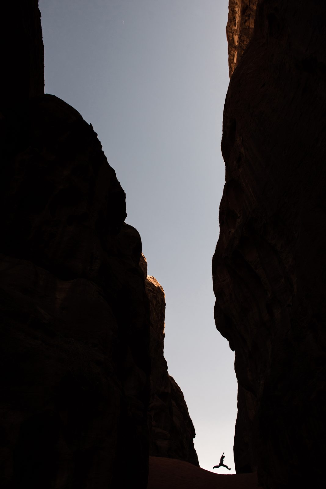 A narrow passage of light between rock formations